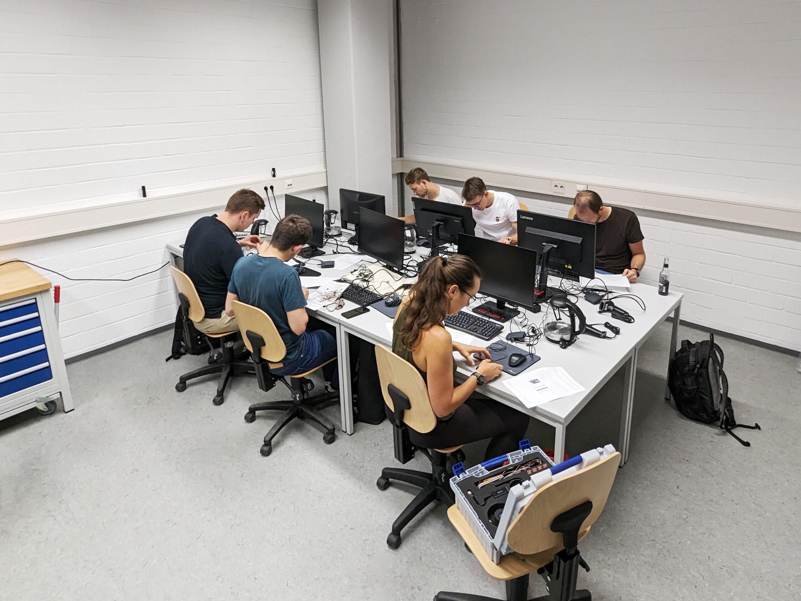 The participants are working on their lab tasks, setting up their Raspberry-PIs.